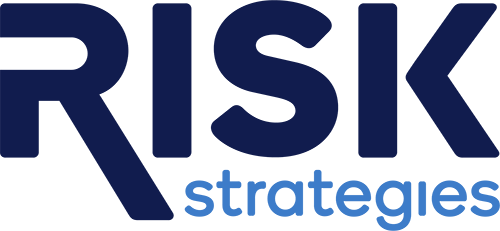 Risk Strategies  logo with a background that transitions from dark to light, featuring the word  RISK  in bold capital letters and the words  STRATEGIES  beneath it.
